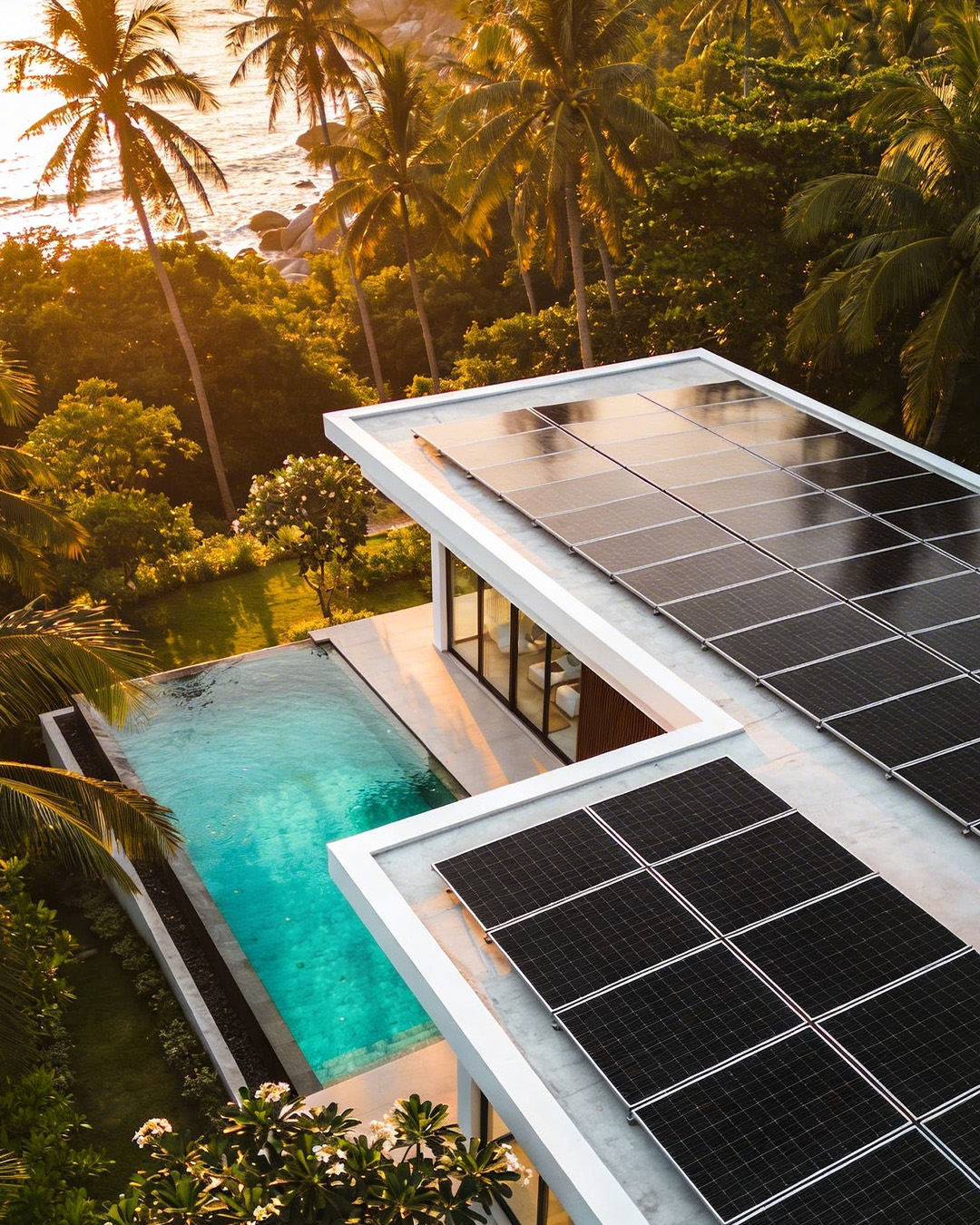 Solar panels on luxury villa rooftop with ocean view on Koh Samui